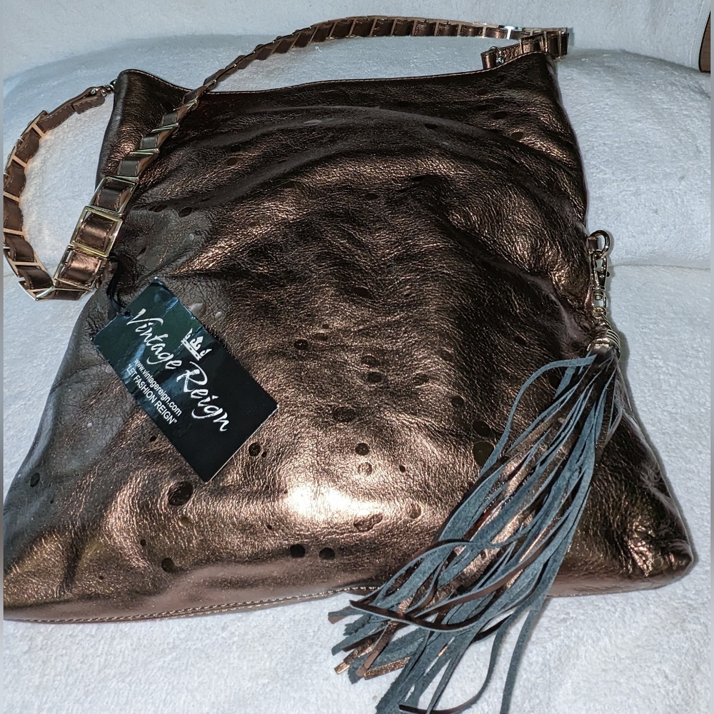 Vintage Reign bronze ADI leather shoulder bag.